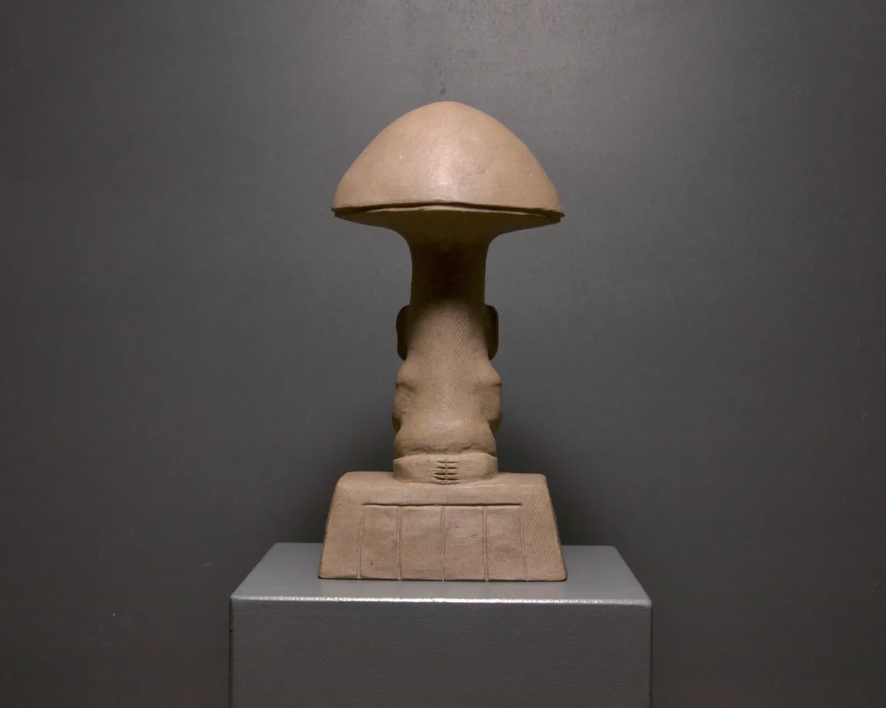 Woman with Metate, back view